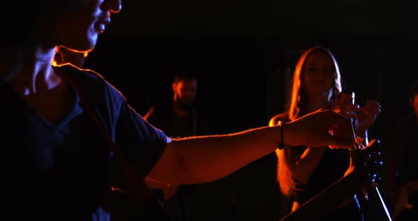 Band performing in studio alt