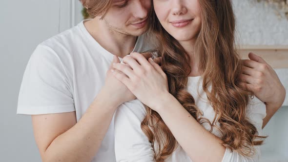 Cropped Shot Young Man Hugs Caucasian Woman Cuddling Stroking Hair alt