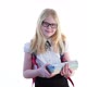 Beautiful Schoolgirl with a School Backpack and Wearing Glasses Posing in the Studio on a White - VideoHive Item for Sale