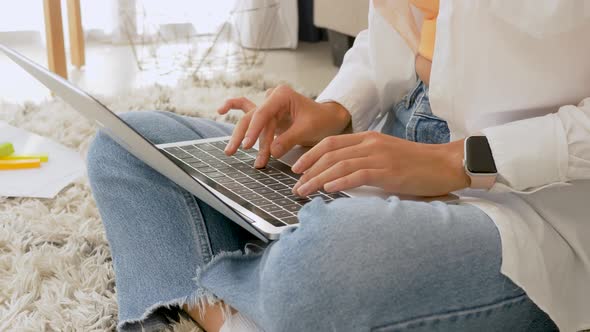 Woman's hands pressing keys on a laptop keyboard trying to access data alt