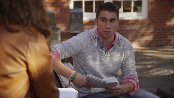 College students on campus meet in courtyard