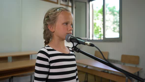 Seven Year Old Girl Practices Vocal