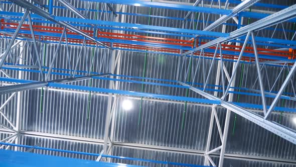 Indoors Large Modern Industrial Structures Warehouse Building With Metal Shelves alt