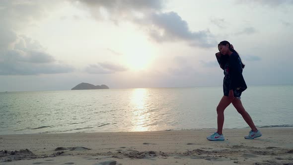 Cute Asian Girl in Kimono Walking on a Beach at Sunset in Slow Motion Thailand alt