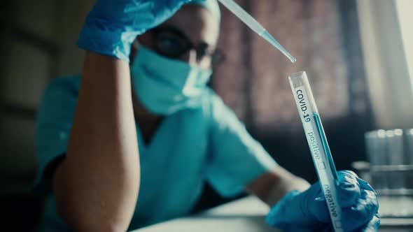 Doctor taking samples from coronavirus COVID-19 test tube