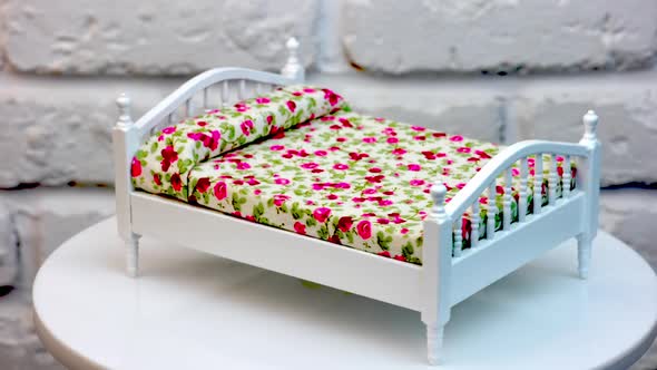 Toy miniature wooden furniture. Children toy furniture in studio shot, rotation alt