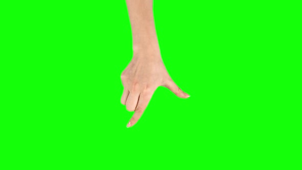 Female Hand Is Performing Pinch at Tablet Screen Gesture on Green Screen. Close Up alt