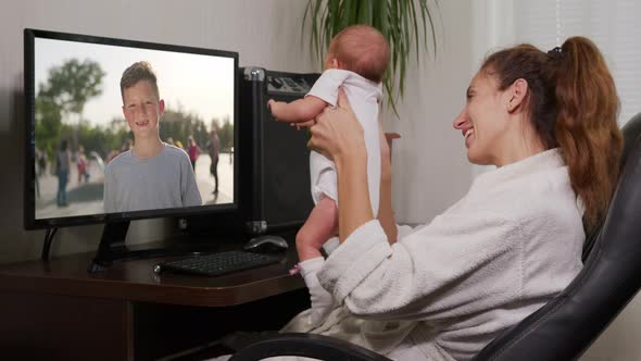 Authentic Shot of Happy Family with Her Kids Are Making a Selfie or Video Call. Concept of alt