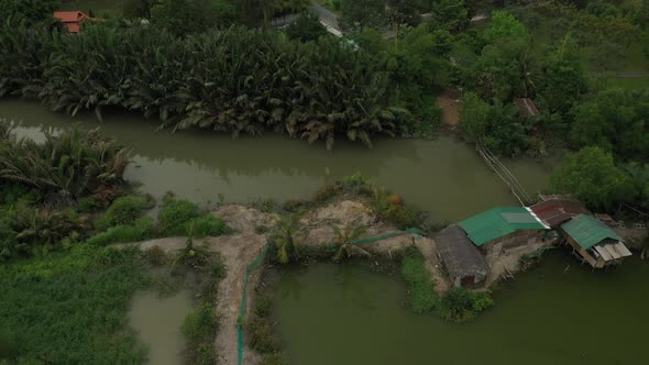 orbit drone shot of wetlands on the outskirts of Ho Chi Minh City, Vietnam. alt