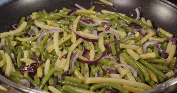 Cooking Asparagus With Onions And Spices In A Pan. Hot Dish