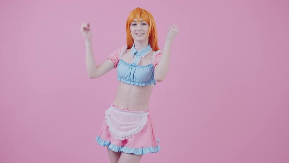 Caucasian RedHaired Teenage Cheerleader Girl Cheers Up Her Team Medium Long Studio Shot Pink alt