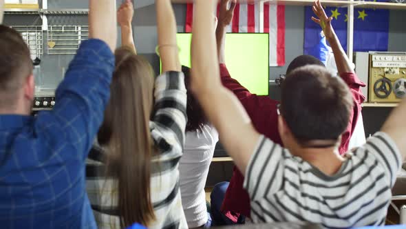 Young people shouting in front of green screen