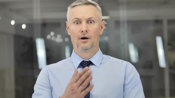Portrait of Grey Hair Businessman in Shock Wondering in Awe alt