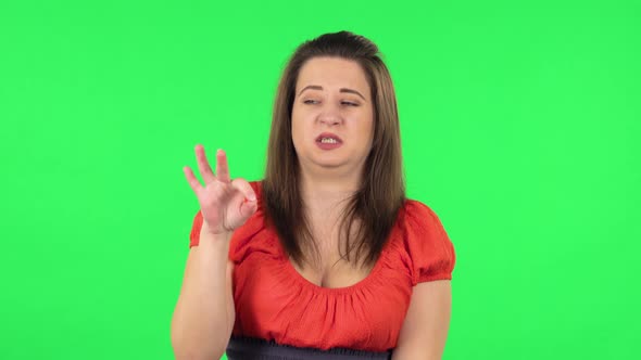 Portrait of Cute Girl Is Showing Disgust for Bad Smell or Taste. Green Screen alt