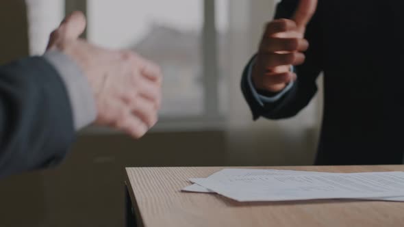 Close Up Male Hands Multiethnic Caucasian and Afro Business People Men Shaking Successful Corporate alt