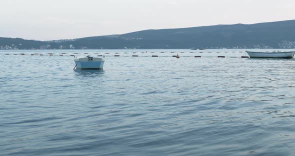 A Boat Docked in Marina in the Evening