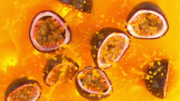 Super Slow Motion Shot of Falling Marakuja Cuts Into Fresh Juice Liquid at 1000Fps alt