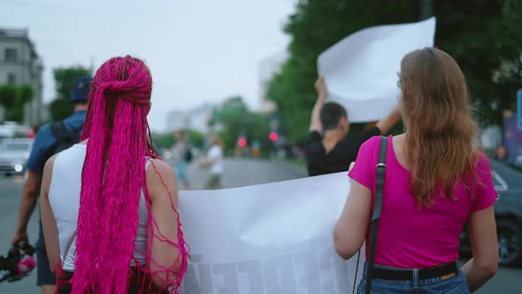 Feminist Girl with Banner Placard Marching in Justice Rally Strike on Streets alt