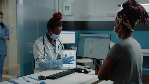 Medic Explaining Bones Fracture to Patient for Osteopathy Examination alt