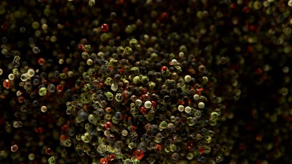 Super Slow Motion Shot of Color Pepper Explosion on Black Background at 1000Fps alt