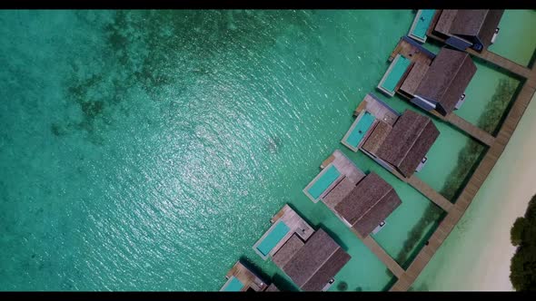 Aerial top view scenery of marine coastline beach lifestyle by blue sea with white sandy background  alt