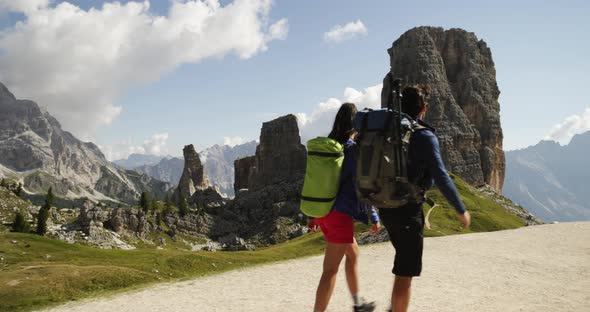 Man and Woman Couple Hiking Along Cinque Torri Trail Path