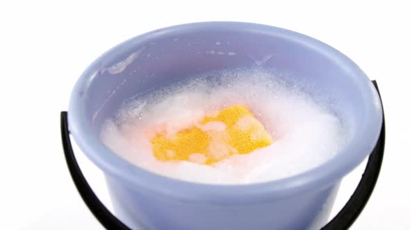 Plastic bucket with cleaning sponge alt