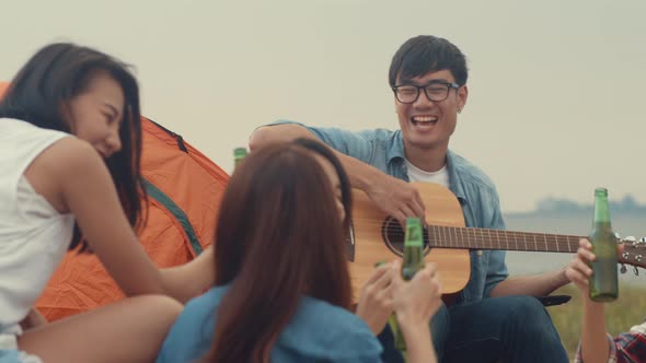 Group of Asia best friends teenagers drink beer chill dance enjoy guitar music with happy moments.