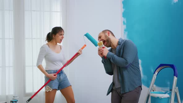 Husband Singing on Painting Brush alt