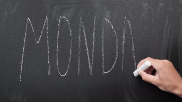 Monday written on blackboard. alt