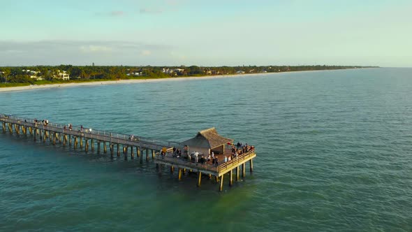 Tourists Watch Sunset From the Pier, Aerial View