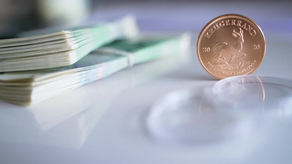 South African Krugerrand in a Vertical Position with the Currency of Poland alt