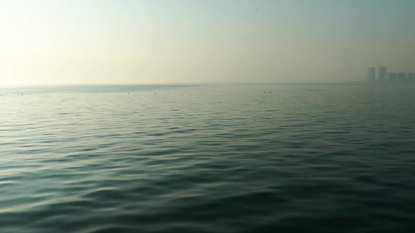 Calm Sea View Seascape and City Silhouette at the Back alt