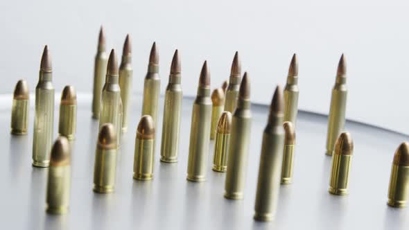 Cinematic rotating shot of bullets on a metallic surface - BULLETS 076 alt