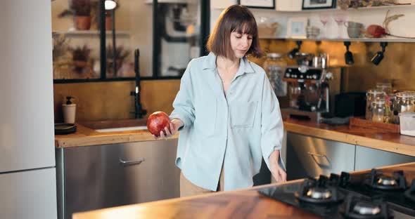 Woman with Pomegranates in the Kitchen alt