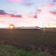 High speed white and red train is passing against a beautiful sunset sky - VideoHive Item for Sale