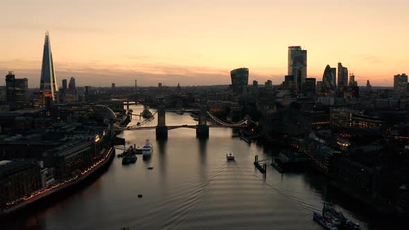 Aerial view of London, River Thames and Tower Bridge just after the sun has set and the sky is lit. alt
