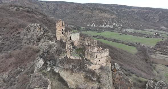 Aerial view of Drisi Castle situated on a mountain above the Tedzami River gorge. Georgia 2022 alt