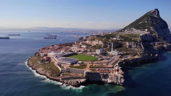 Aerial View Of Gibraltar's Europa Point With Lighthouse. drone pullback alt
