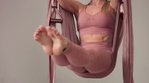Adorable Woman Yoga Trainer During Aerial Yoga Master Class  alt