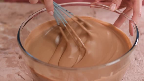 Woman Making Delicious Chocolate Cream Closeup