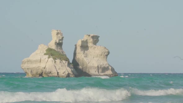 Slowmotion close up shot of the two sisters (Le due sorelle) at the beach in Apulia (South Italy) wi alt
