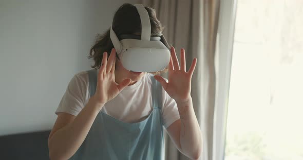 Woman Exploring Cyberspace with Virtual Reality Headset alt