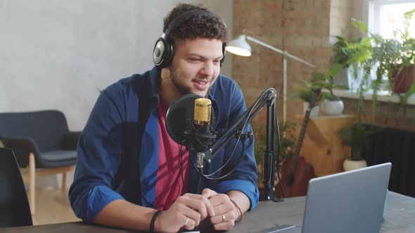 Young Positive Man Recording Podcast alt