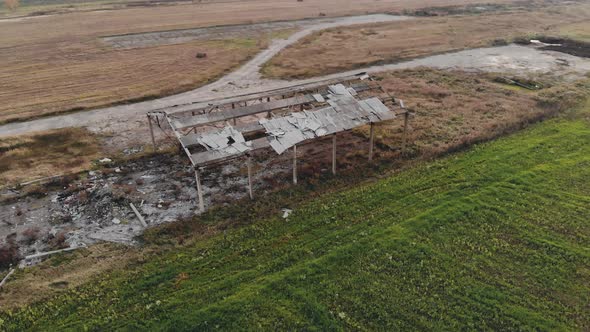 Abandoned and Destroyed Farm in the Countryside Due To the Financial Crisis. Aerial View alt