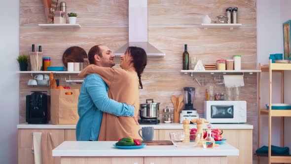 Tender Couple Dancing in Kitchen alt