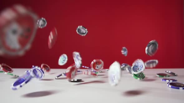 Poker Chips Falling on the White Table on the Red Background, 4x Slow Motion alt