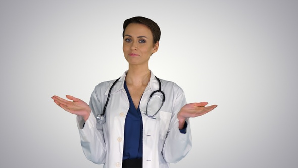 Young woman doctor clapping hands on gradient background. alt