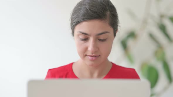 Close Up of Indian Woman Using Laptop in Office alt