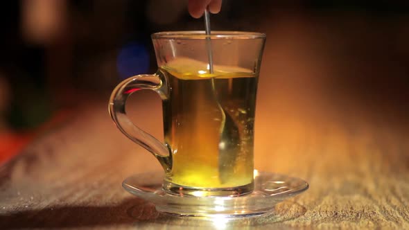 Glass of tea on a counter, in a bar